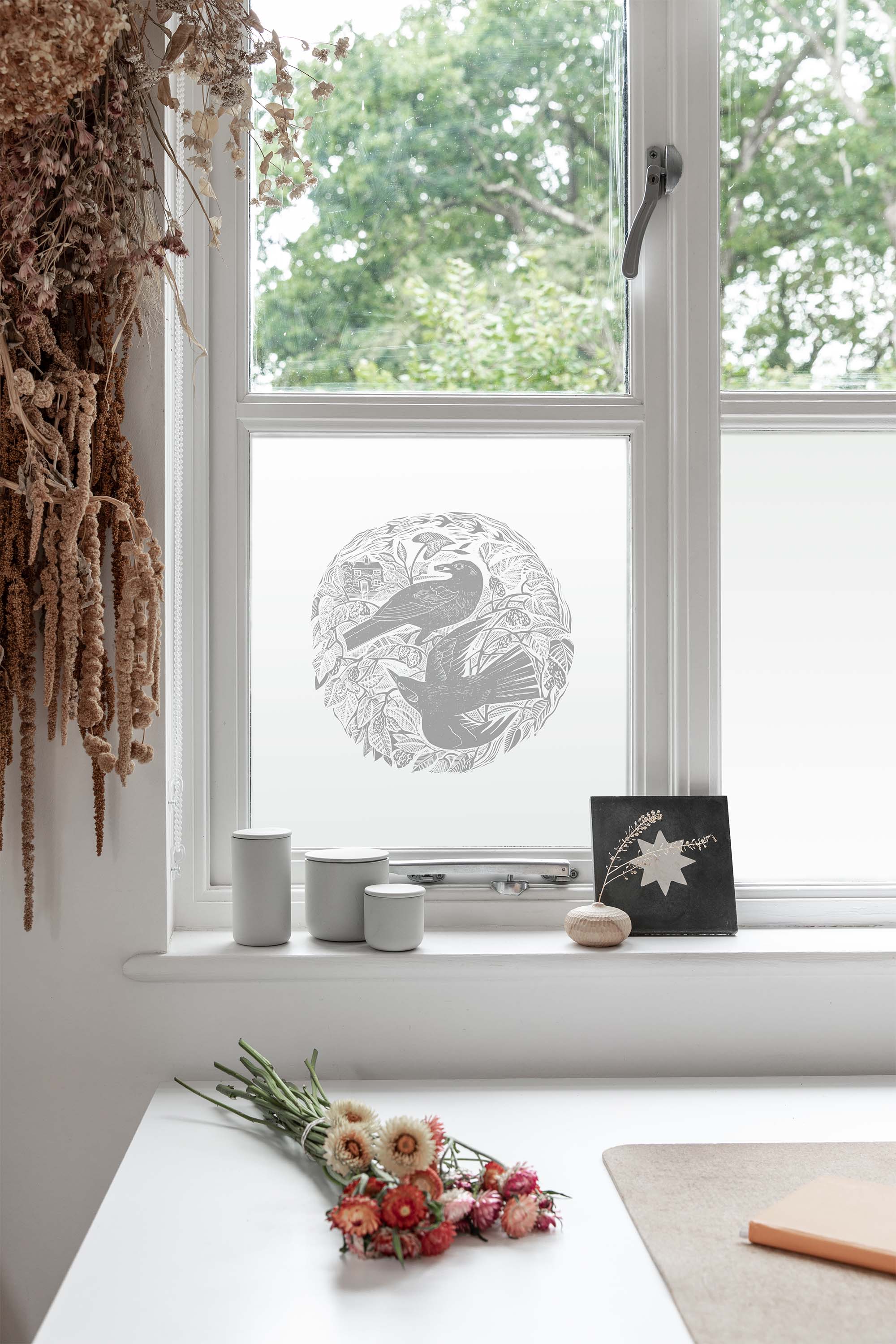 Decorative window film with blackbirds by Angela Harding 